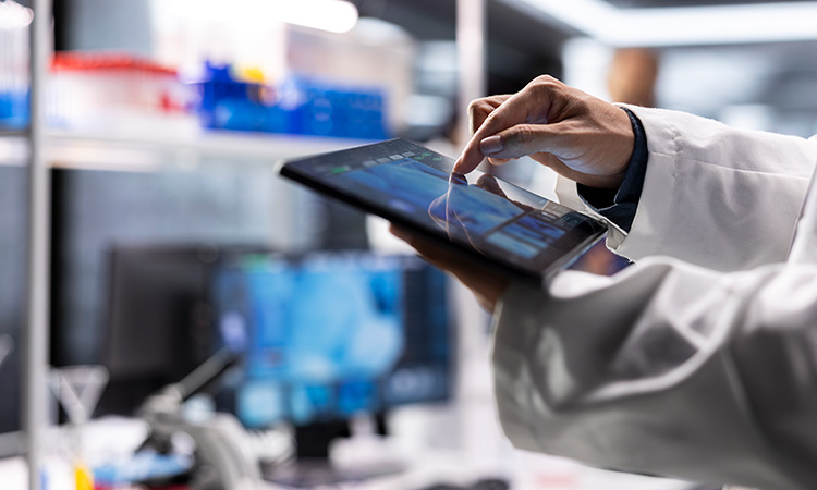 close-up-researcher-laboratory-performing-biochemistry-tablet-testing-v2-750px.jpg
