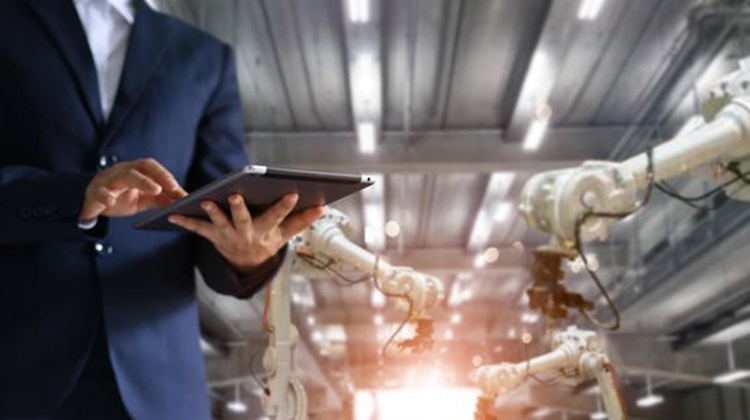 industrial-engineer-check-and-control-automation-robot-arms-machine-in-intelligent-factory-industrial-on-data-system-750px.jpg