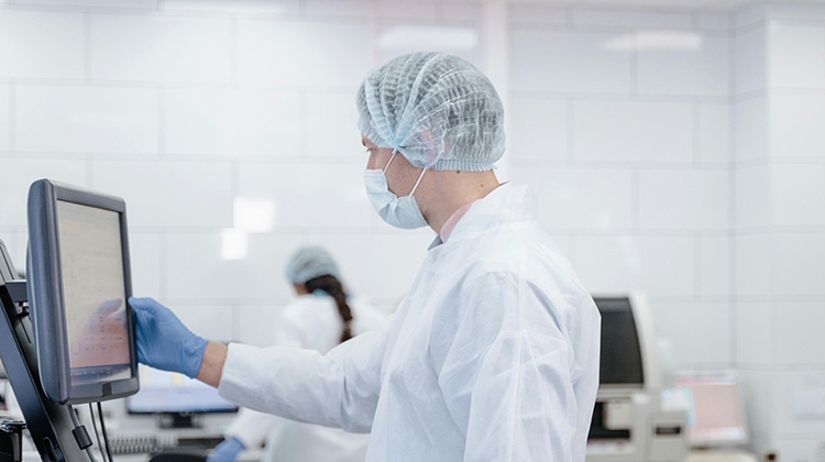 a-man-in-white-lab-gown-touching-a-computer-screen-pexels-tima-miroshnichenko