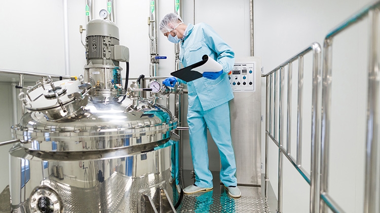 scientist-blue-lab-suit-working-with-control-panel-look-750px.jpg