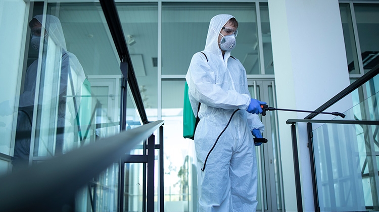 unrecognizable-person-white-protection-suit-disinfecting-public-areas-stop-spreading-highly-750px.jpg