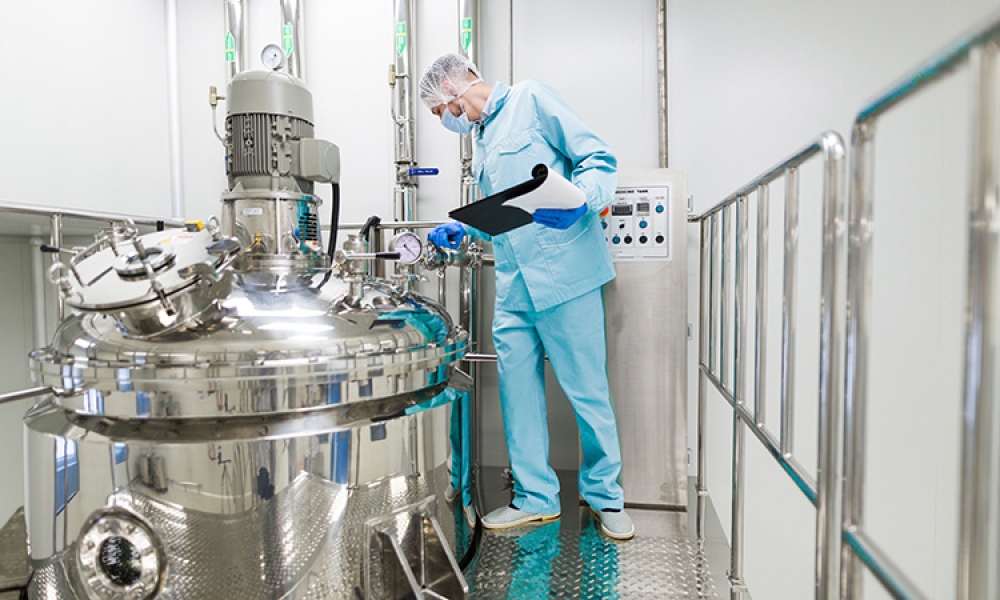 scientist-blue-lab-suit-working-with-control-panel-look-750px.jpg