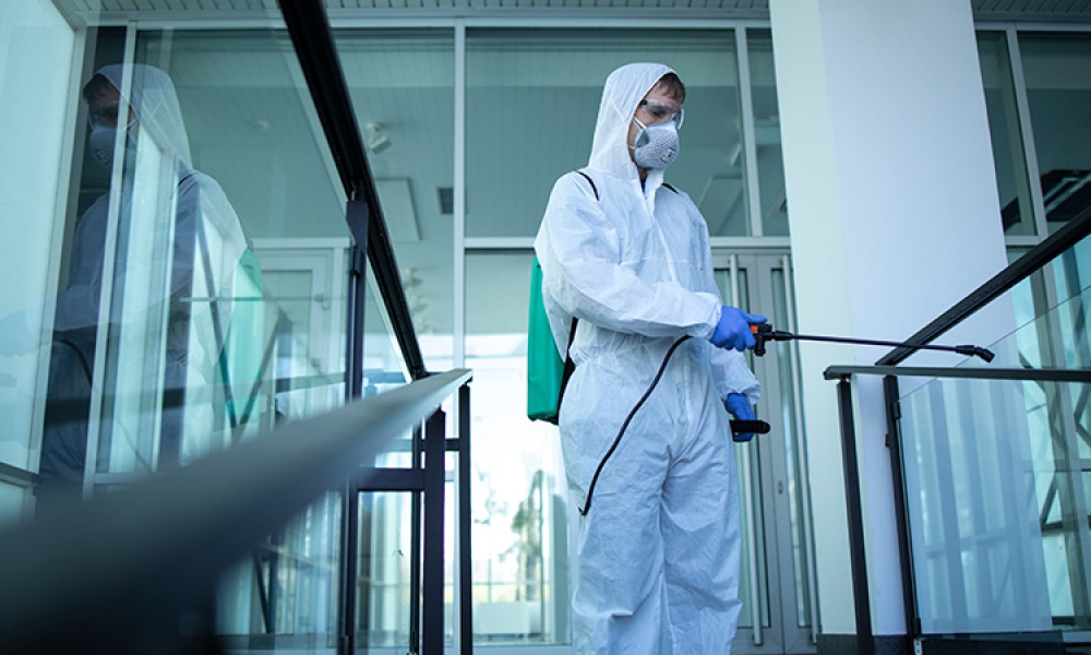 unrecognizable-person-white-protection-suit-disinfecting-public-areas-stop-spreading-highly-750px.jpg